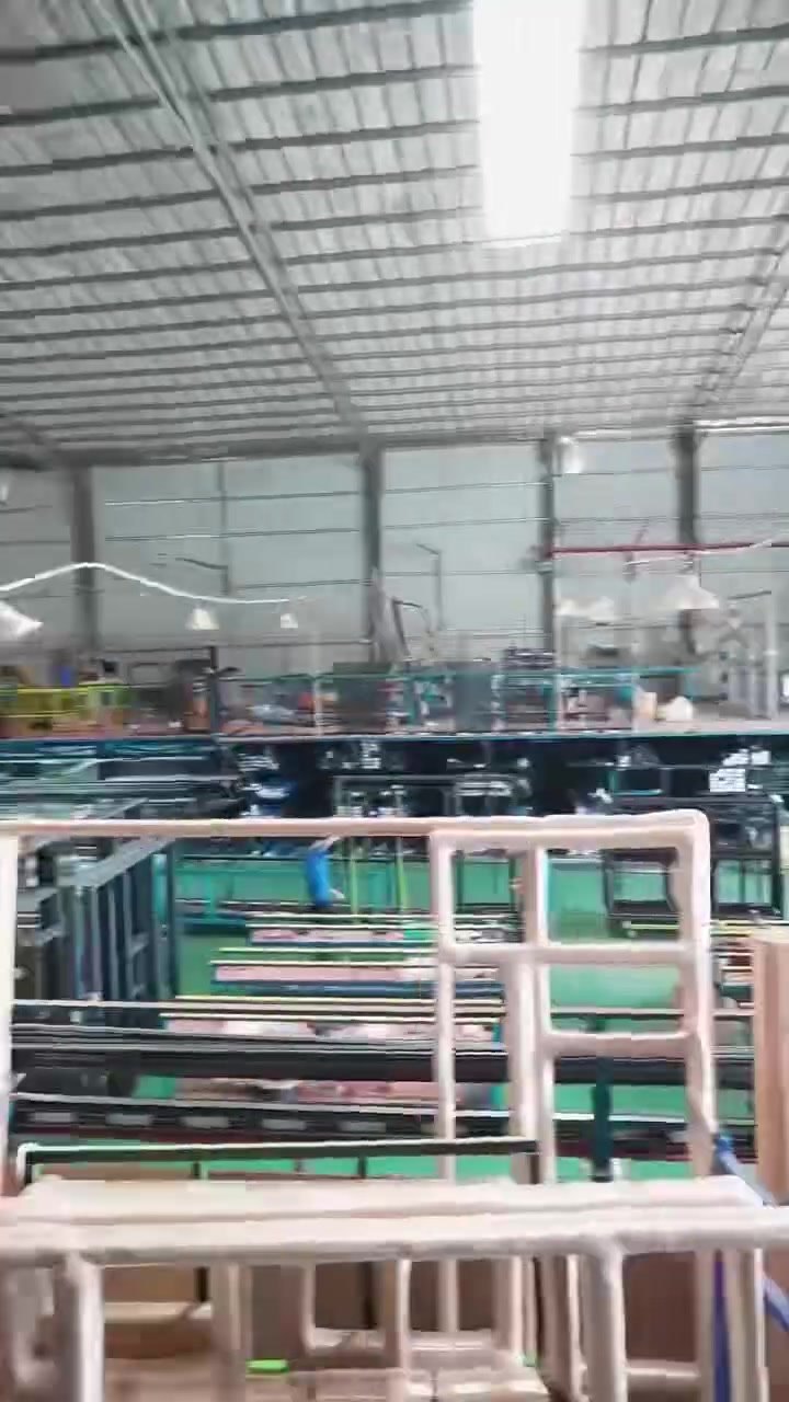 Aluminium window frames on assembly benches inside the Jiuhua workshop in Foshan